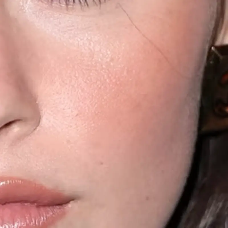 Gracie Abrams' skin tone — light with warm peachy undertone and natural rosy flush